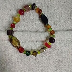 Green red black beaded stretch bracelet